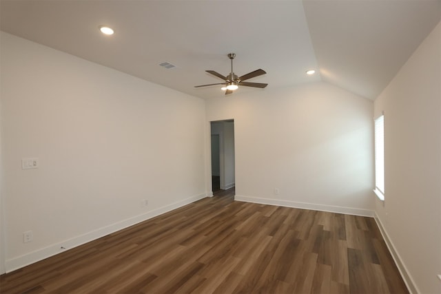 spare room featuring visible vents, baseboards, lofted ceiling, recessed lighting, and dark wood-style floors