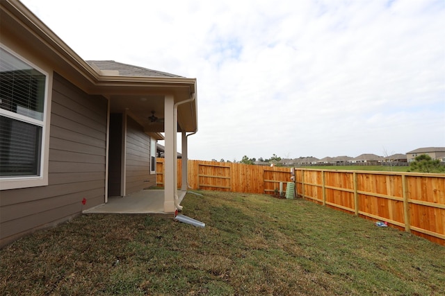 view of yard with a patio and a fenced backyard