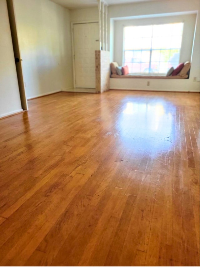 unfurnished room with light hardwood / wood-style flooring