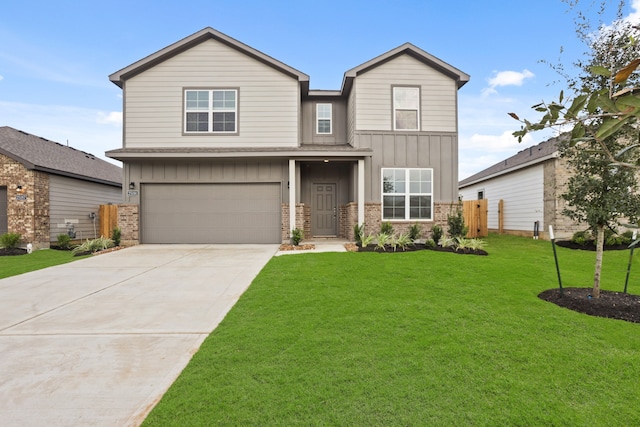 view of front of house with a garage and a front lawn