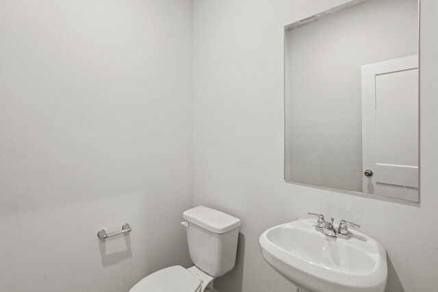 bathroom with sink and toilet