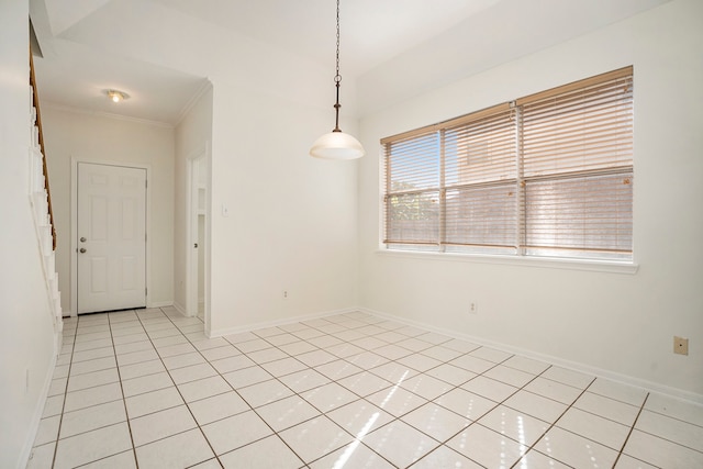 tiled empty room with crown molding