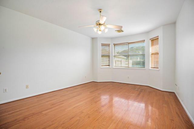 unfurnished room featuring light hardwood / wood-style flooring and ceiling fan