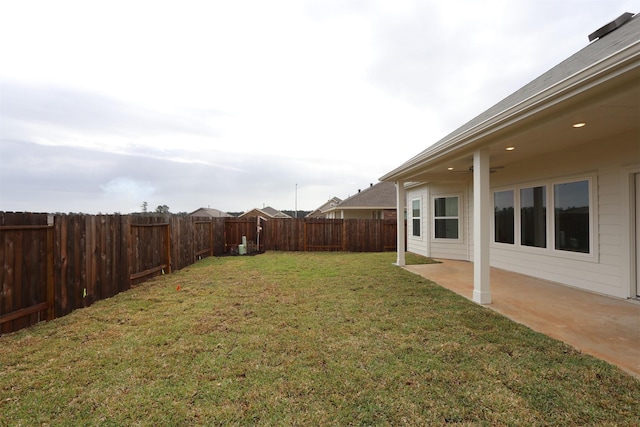 view of yard with a patio and a fenced backyard