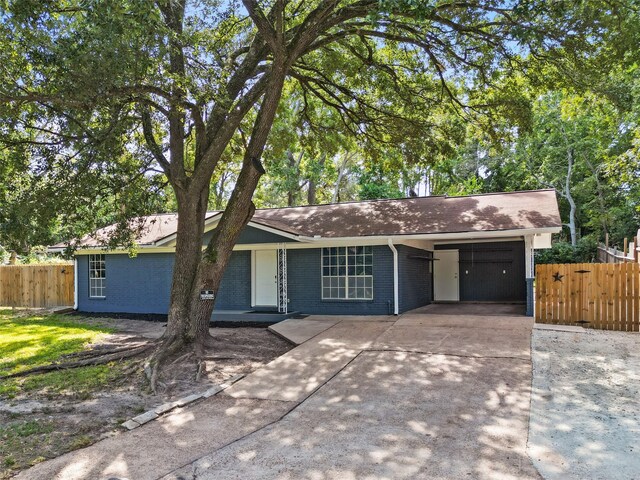 ranch-style home with a carport