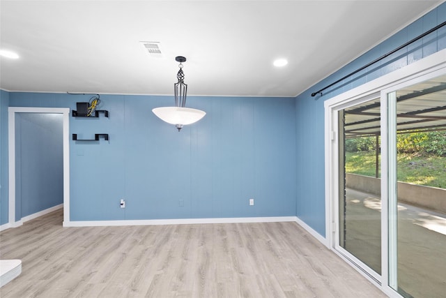 spare room featuring light hardwood / wood-style flooring