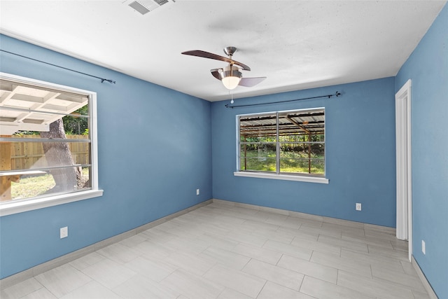 empty room featuring ceiling fan