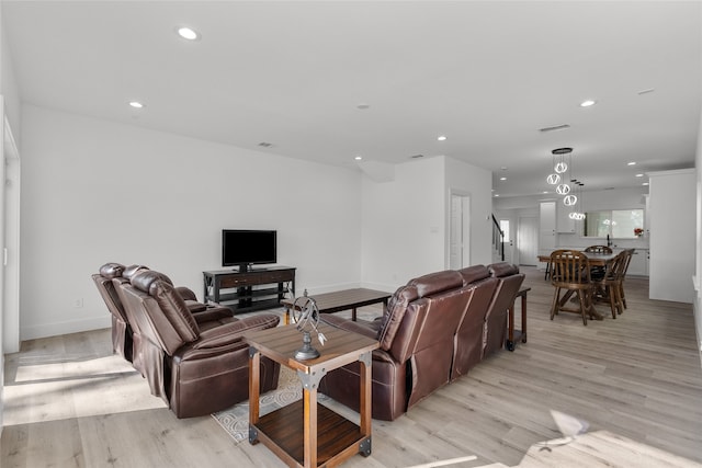 living room with light hardwood / wood-style floors