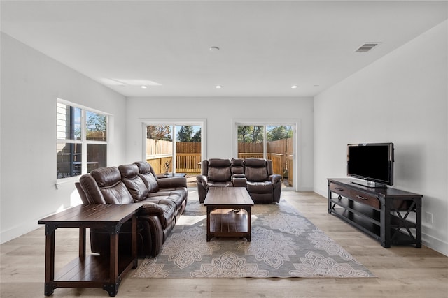 living room with light hardwood / wood-style floors