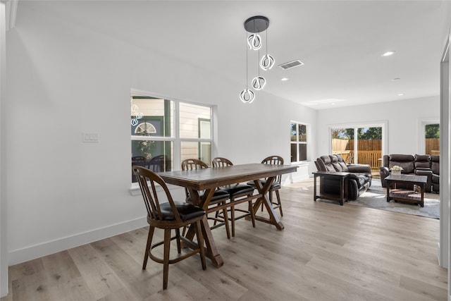 dining space with light wood-type flooring