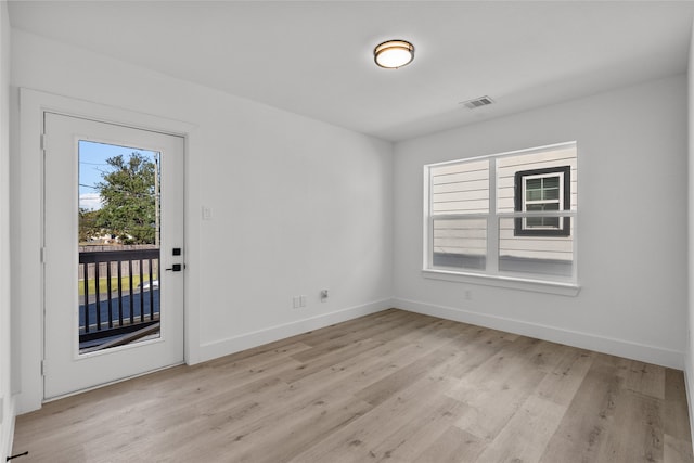 unfurnished room featuring light wood-type flooring