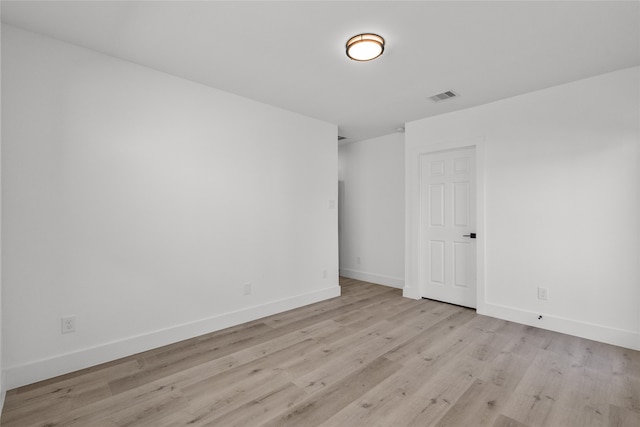 spare room featuring light hardwood / wood-style flooring