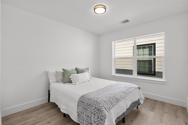 bedroom featuring light hardwood / wood-style floors