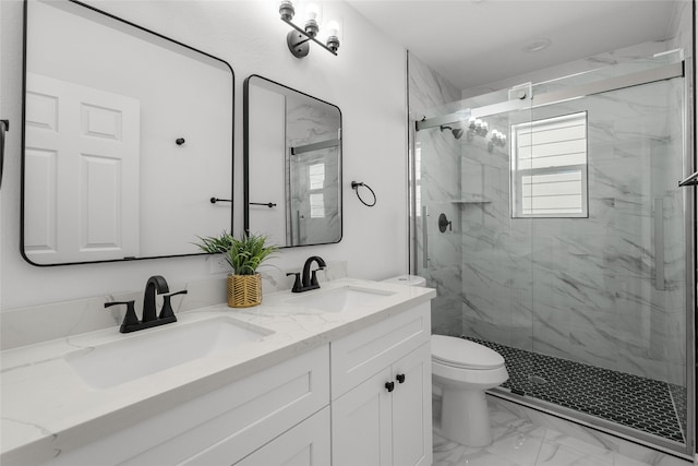 bathroom with toilet, an enclosed shower, and vanity