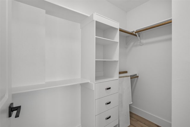 walk in closet featuring hardwood / wood-style flooring