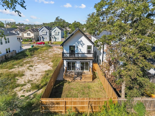 rear view of house with a wooden deck