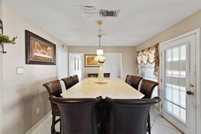 dining room with a textured ceiling