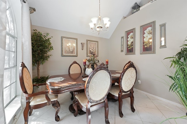 dining space featuring an inviting chandelier, lofted ceiling, and a healthy amount of sunlight