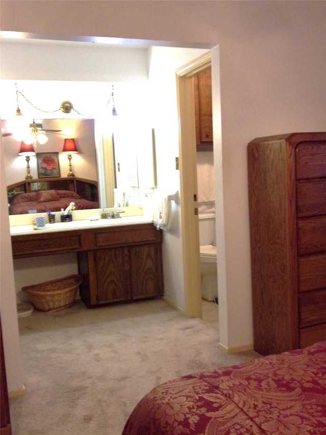 bathroom with vanity and toilet