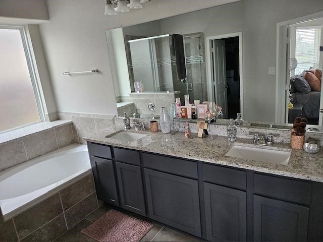 bathroom with vanity, tile patterned floors, and independent shower and bath