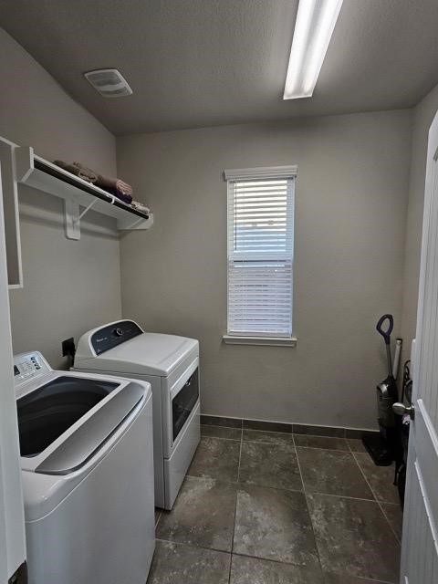 washroom featuring independent washer and dryer