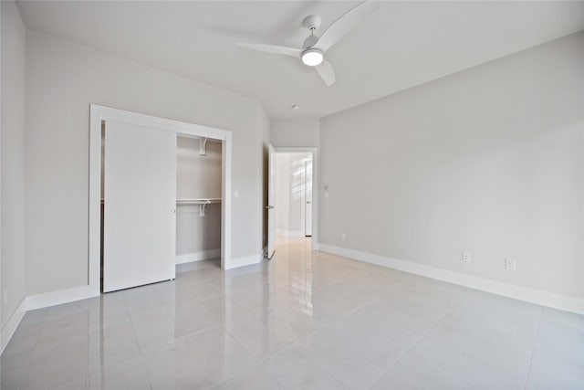 unfurnished bedroom featuring a closet, ceiling fan, and light tile patterned floors