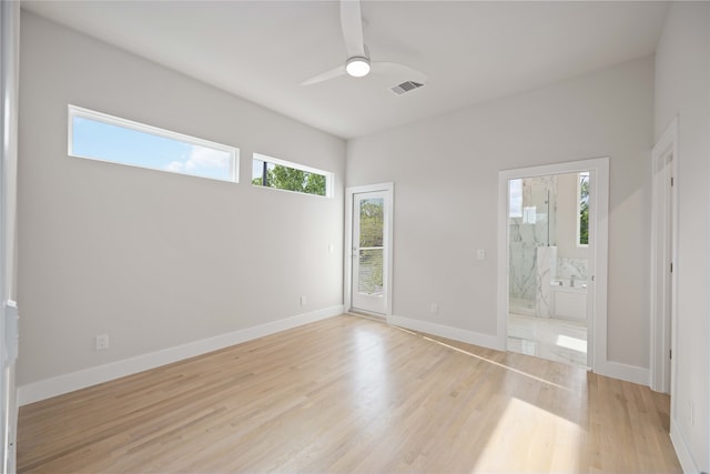 empty room featuring ceiling fan and light wood-type flooring