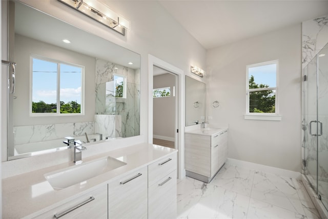 bathroom featuring walk in shower and vanity