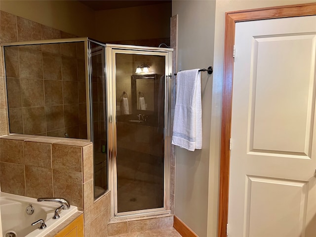 bathroom featuring independent shower and bath