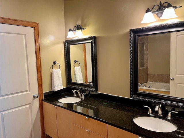 bathroom featuring vanity and a tub to relax in