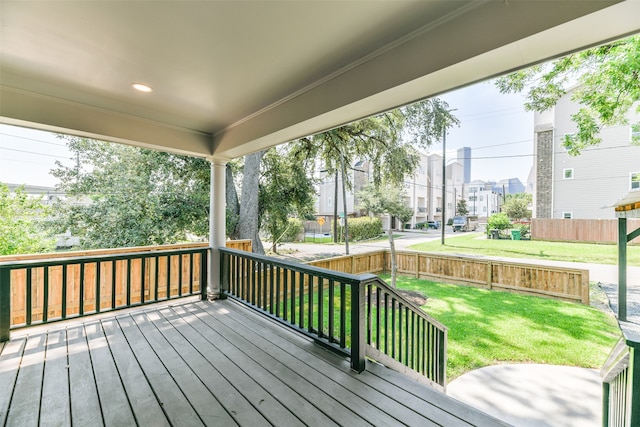 wooden terrace with a yard