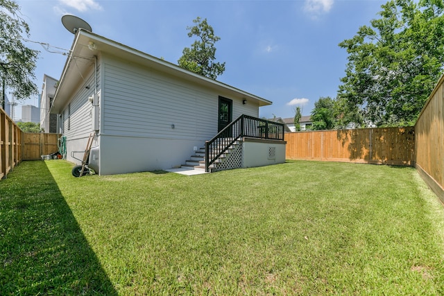 back of house with a lawn