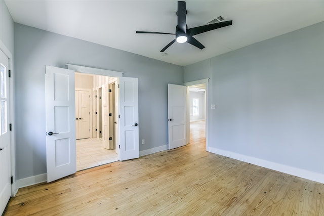 unfurnished bedroom with light wood-type flooring and ceiling fan