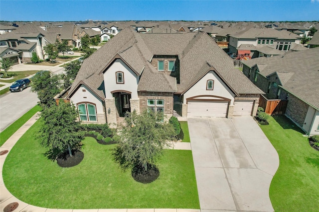 french provincial home with a front lawn