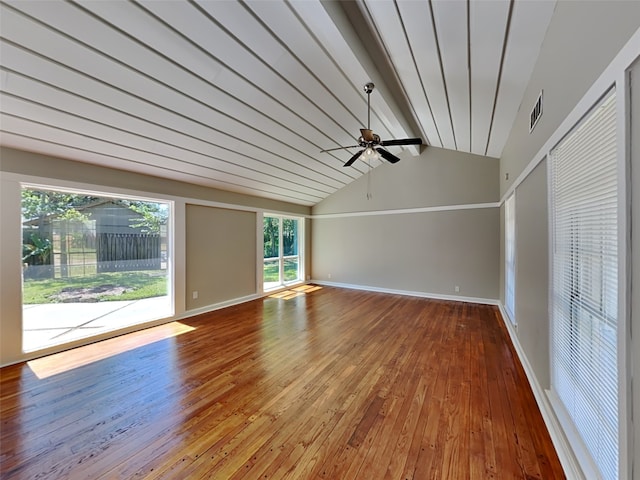 unfurnished room with lofted ceiling with beams, hardwood / wood-style flooring, and ceiling fan