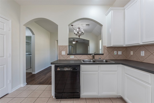 kitchen with light tile patterned flooring, sink, white cabinetry, and black dishwasher