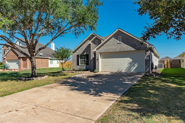 view of front of home featuring a garage and a front yard