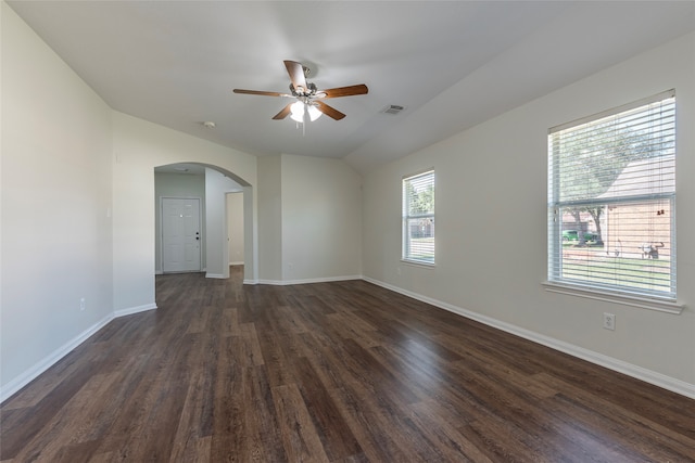 unfurnished room featuring ceiling fan, lofted ceiling, and dark wood-type flooring