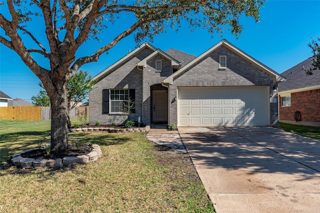 view of front of home with a garage and a front lawn