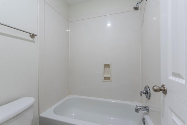 bathroom featuring toilet and bathtub / shower combination