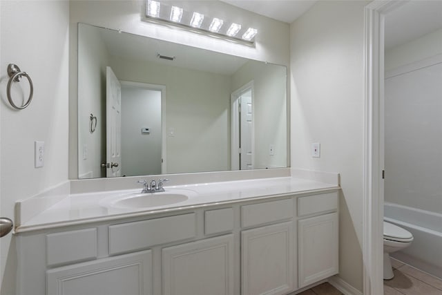 full bathroom featuring vanity, tile patterned flooring, bathtub / shower combination, and toilet