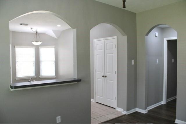 hall featuring tile patterned floors