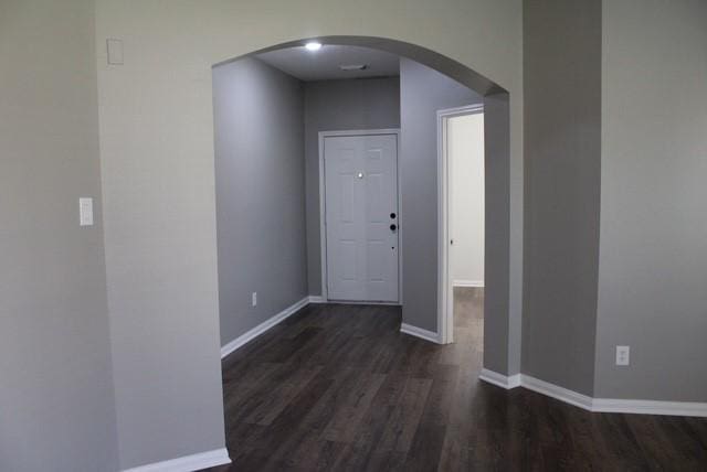 hallway featuring dark hardwood / wood-style flooring