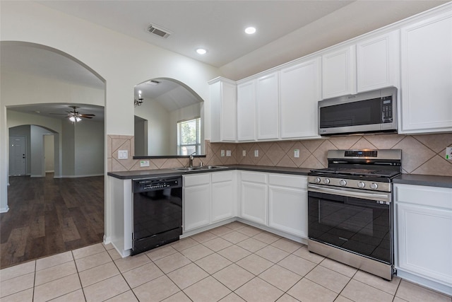 kitchen featuring white cabinetry, stainless steel appliances, and sink