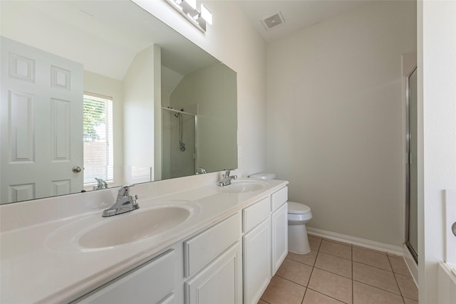 bathroom featuring tile patterned floors, toilet, an enclosed shower, and vanity