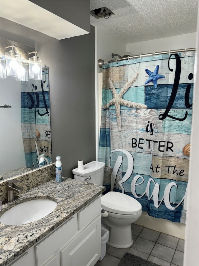 full bathroom with shower / bathtub combination with curtain, vanity, a textured ceiling, toilet, and tile patterned floors