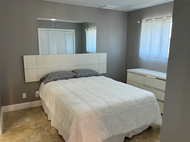 bedroom featuring a textured ceiling