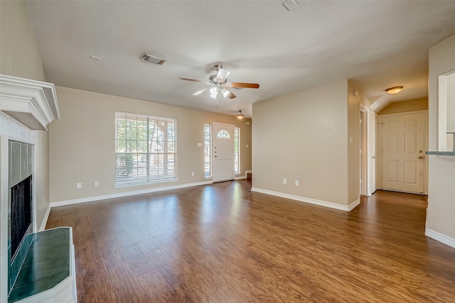 unfurnished living room with ceiling fan and hardwood / wood-style floors