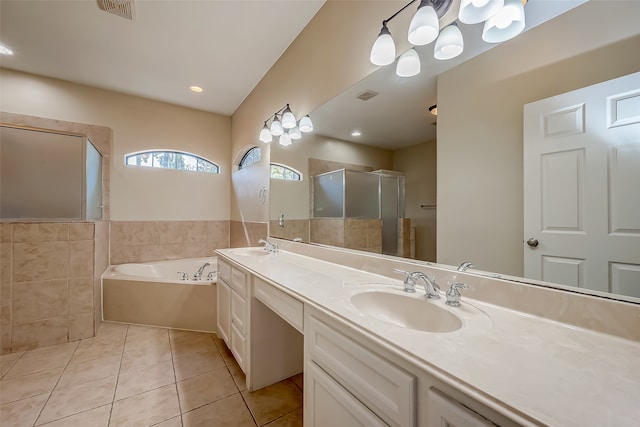 bathroom with vanity, plus walk in shower, and tile patterned flooring