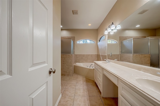 bathroom featuring vanity, independent shower and bath, and tile patterned flooring